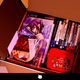 A carboard box is filled to the brim with video games and pop culture memorabilia.